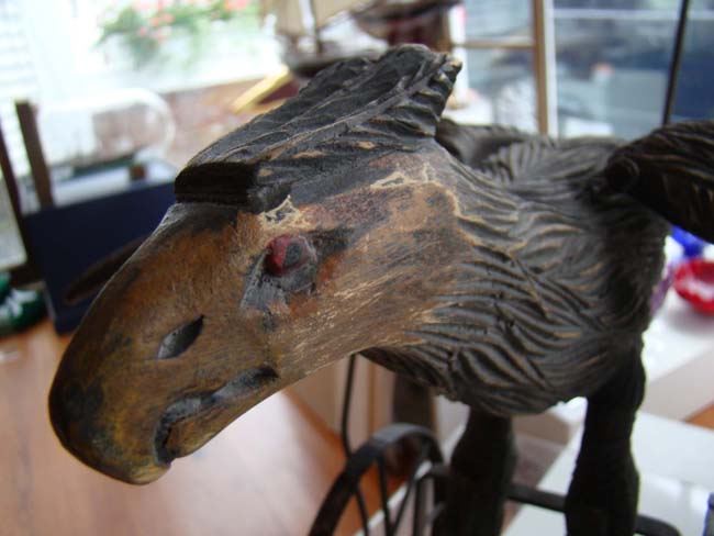 A late Victorian carved wooden spread wing eagle push toy — image 9
